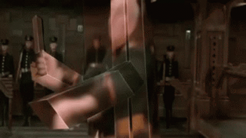A GIF of two characters from Dune 1984 fighting, covered in strange light-refracting cube shields.